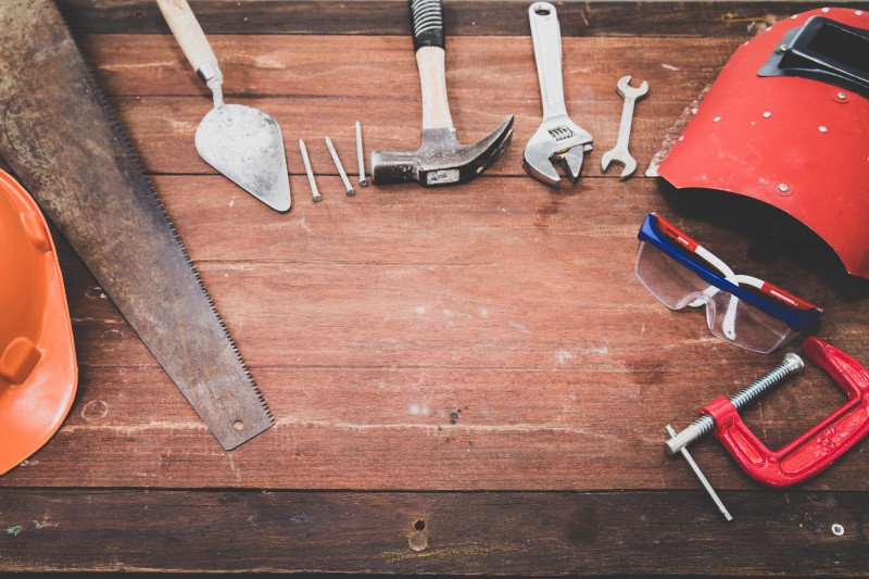Tradesperson using PaperTrail on mobile for job management